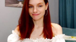 Beautiful redhead touching herself