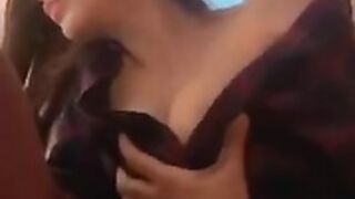 Playing with her tits